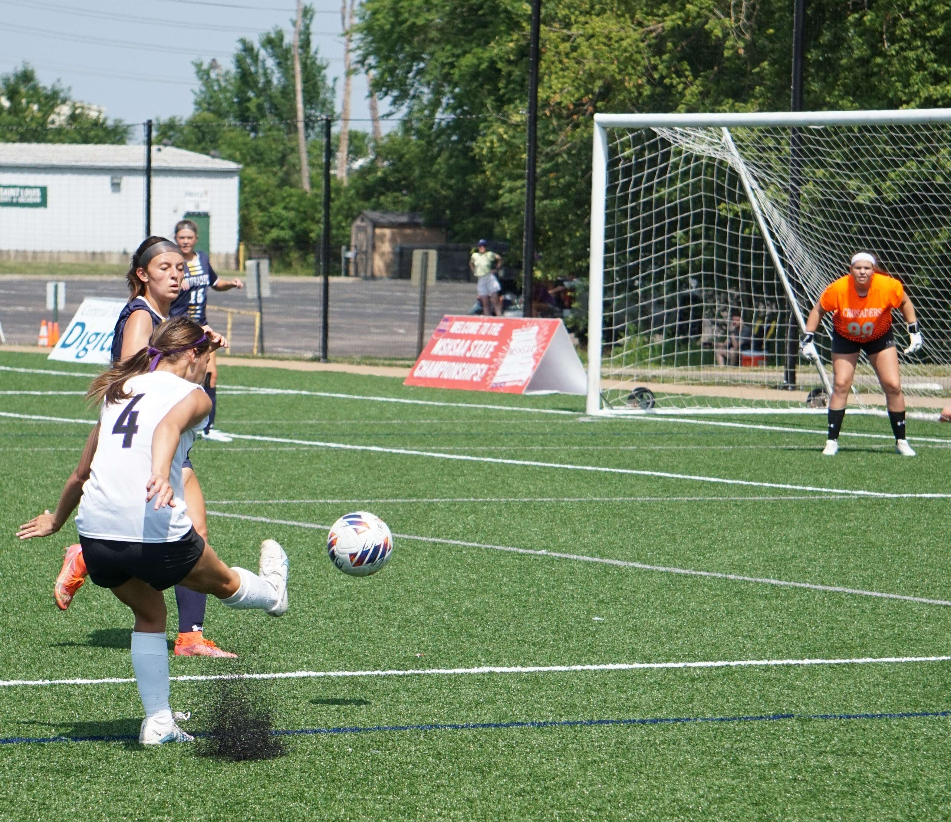 Emily Weddle (4) takes a shot in the first half.