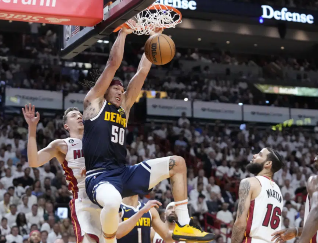 .Denver Nuggets forward Aaron Gordon (50)dunks the ball during the first half of Game 4 of the basketball NBA Finals against the Miami Heat, Friday, June 9, 2023, in Miami. (AP Photo/Wilfredo Lee)