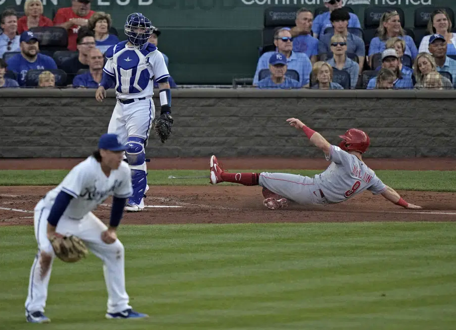 Cincinnati Reds' Matt McLain slides home to score on a double by Jonathan India during the fourth inning of a baseball game against the Kansas City Royals Wednesday, June 14, 2023, in Kansas City, Mo. (AP Photo/Charlie Riedel)