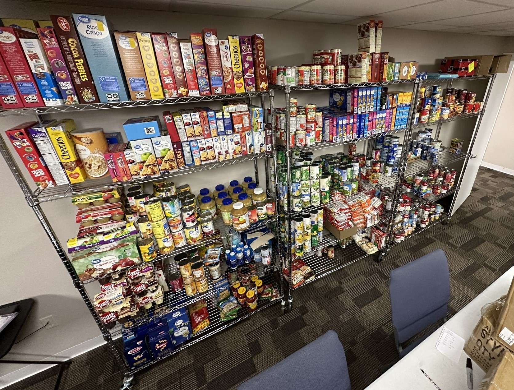 The food pantry shelves are filled at First Call for Help after the Battle of the Businesses contest. Courtesy photo