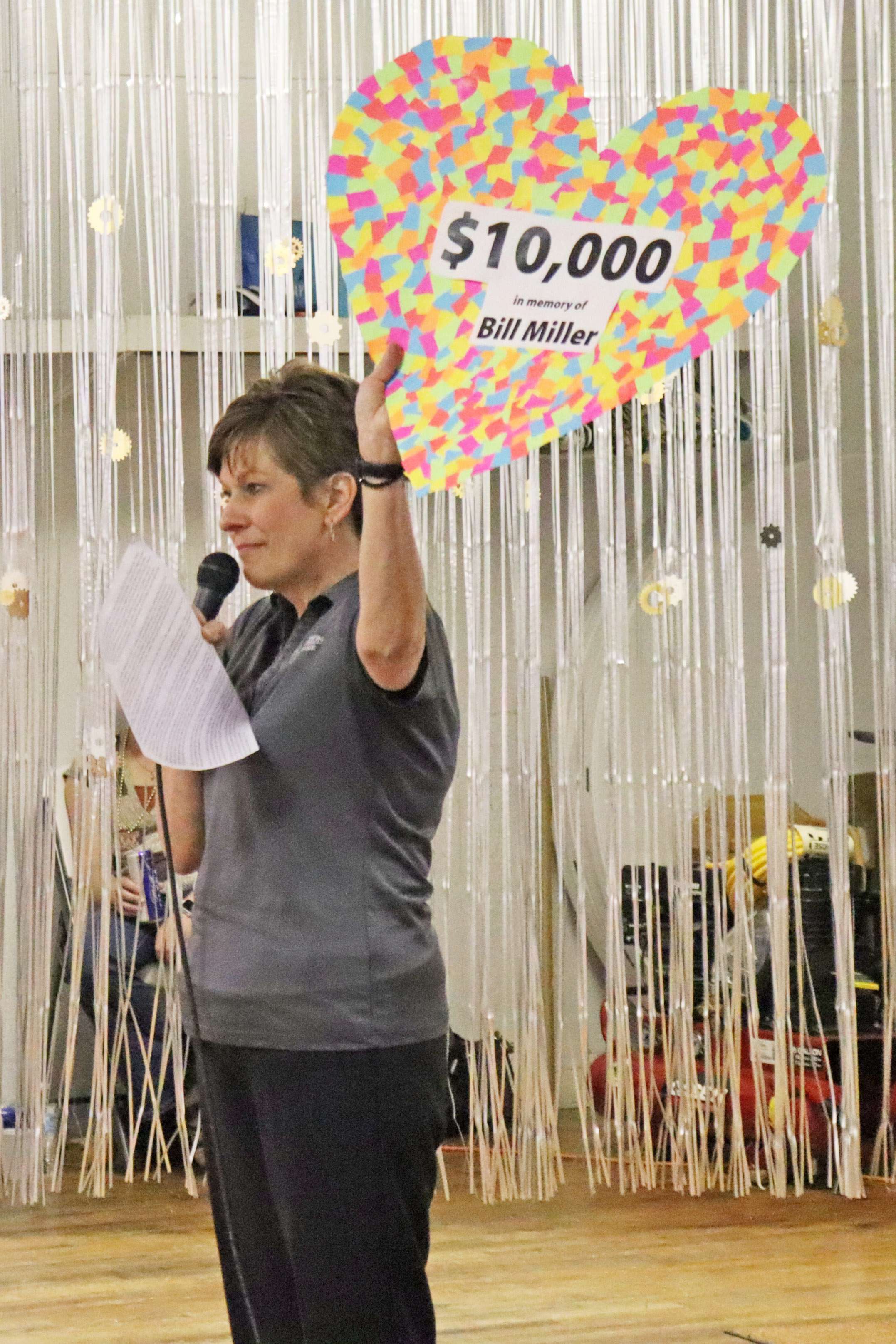 At the 30th Annual Benefit Event, Clara Barton Foundation Director Michelle Moshier reveals to attendees a generous lead donation in memory of Bill Miller to kick off the Gift from the Heart appeal. This resulted in a standing ovation and went on to raise a record-high total of $25,000.