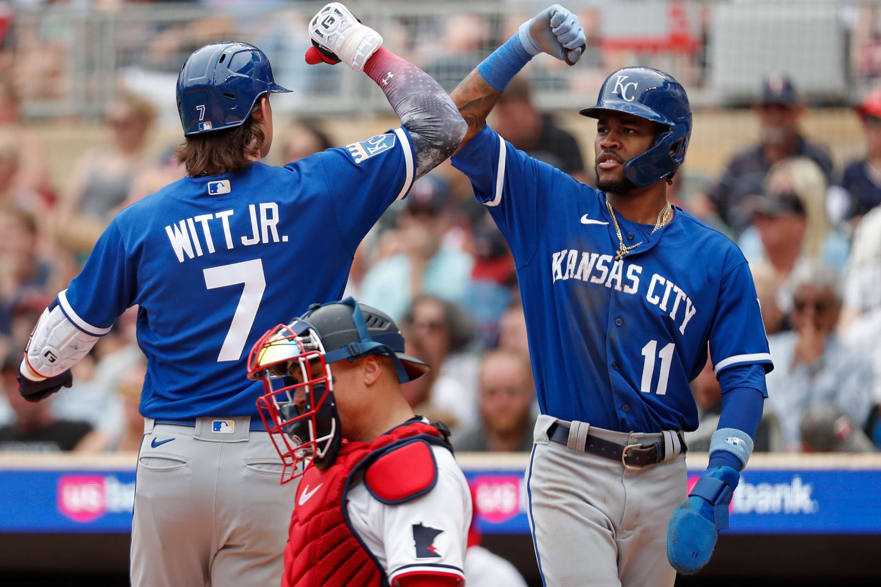 Kansas City Royals' Bobby Witt (7) celebrates his two-run home run with Maikel Garcia (11) against the Minnesota Twins in the fourth inning of a baseball game Tuesday, July 4, 2023, in Minneapolis. (AP Photo/Bruce Kluckhohn)