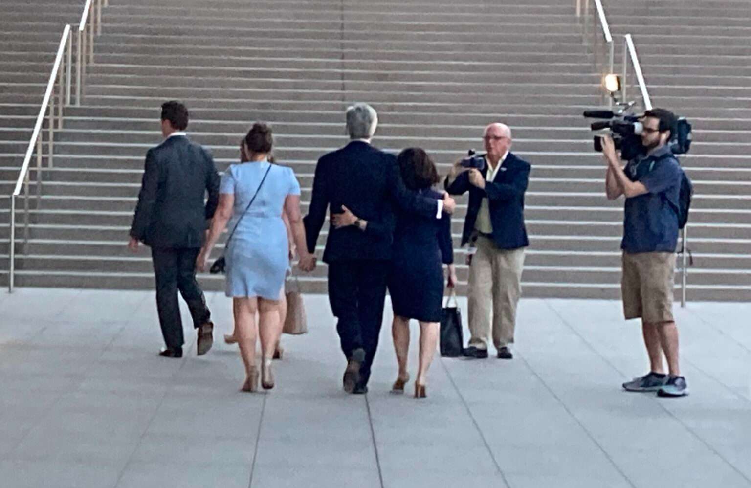 U.S. Rep. Jeff Fortenberry, arm in arm with his wife and a daughter, leaves the U.S. District Courthouse in downtown Los Angeles after a jury found him guilty in March 2022. (Paul Hammel/Nebraska Examiner)