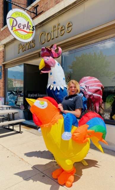 Braylin Bretz, staff member, helps promote additions to the menu at RePerks. The coffee house/restaurant now offers chicken by the bucket and as meals with side dishes.