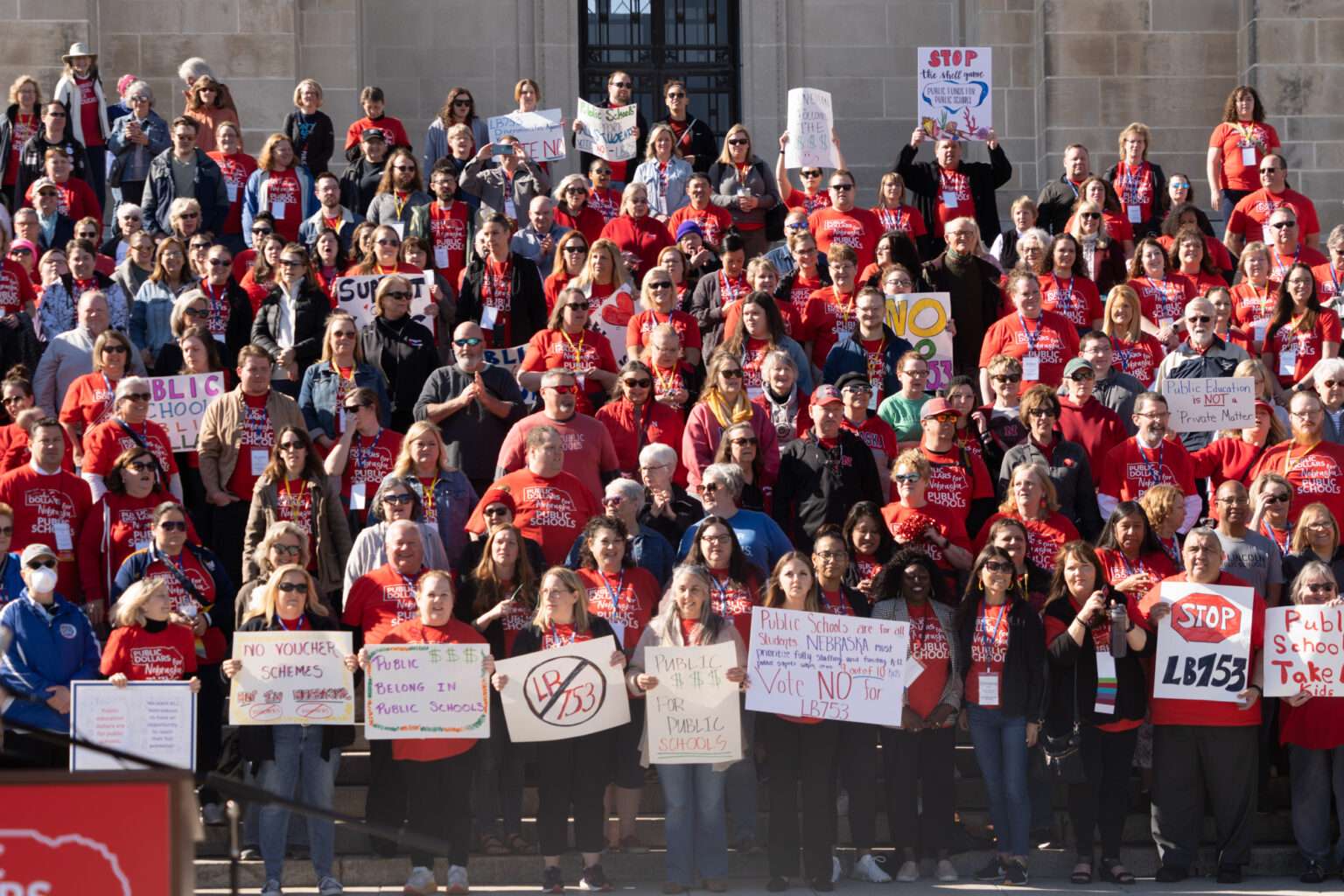 Parents, educators, school leaders and members of the public flood the steps of the Nebraska State Capitol in support of public schools and against an “Opportunity Scholarships” measure on April 29, 2023, in Lincoln, Neb. (Zach Wendling/Nebraska Examiner)