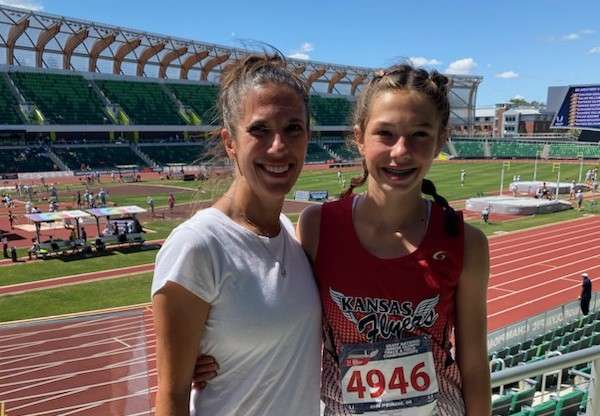 Eleanor Joiner with her mother, Stephanie, at the University of Oregon's Hayward Field.