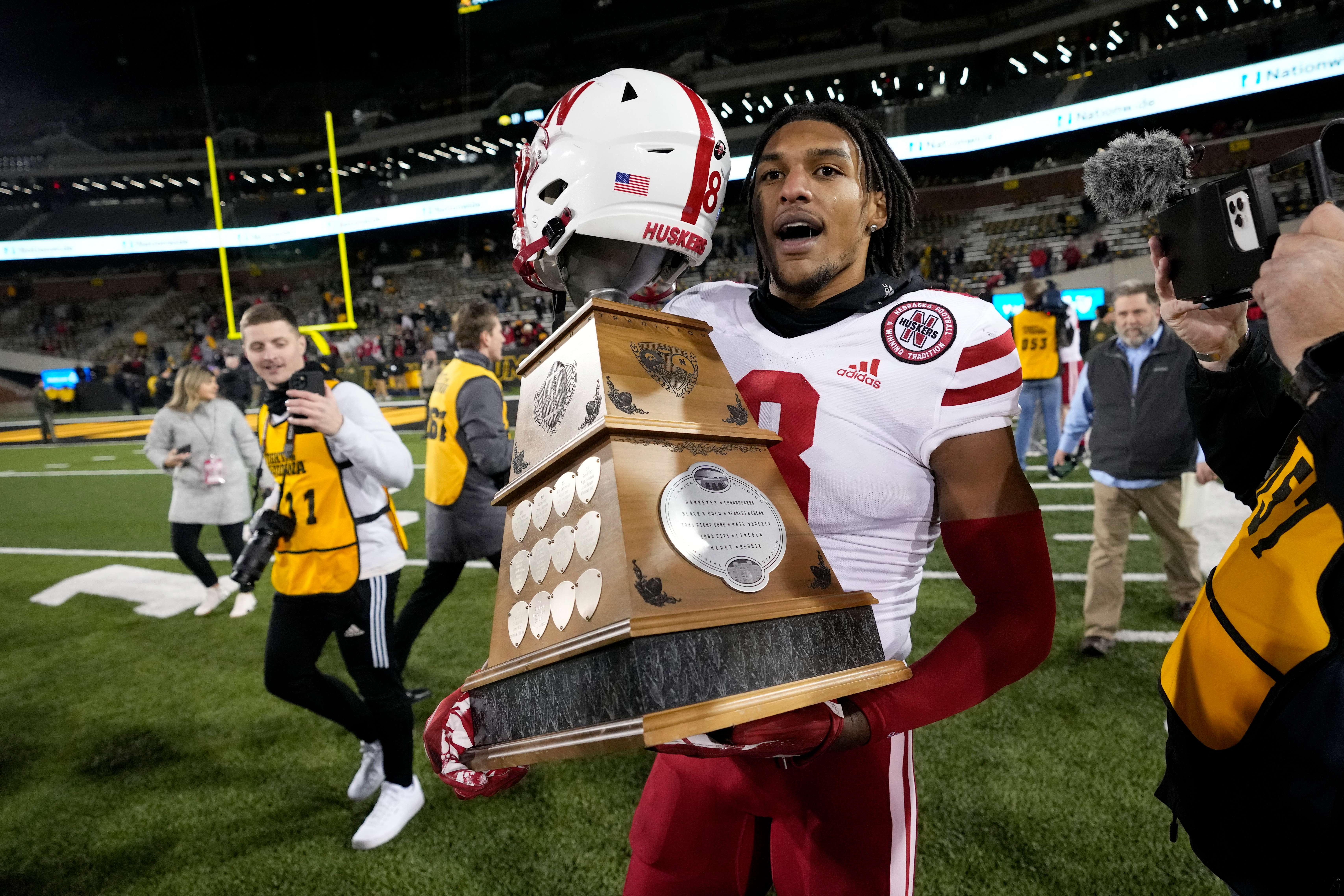 Nebraska defensive back Myles Farmer (8) celebrates after winning an NCAA college football game against Iowa, Friday, Nov. 25, 2022, in Iowa City, Iowa. Nebraska defensive back Myles Farmer, the team's second-leading tackler last season, was not on the 120-man roster when the Cornhuskers opened practice Monday, July 31, 2023, and his return was uncertain.First-year coach Matt Rhule said he suspended Farmer indefinitely. (AP Photo/Charlie Neibergall, File)