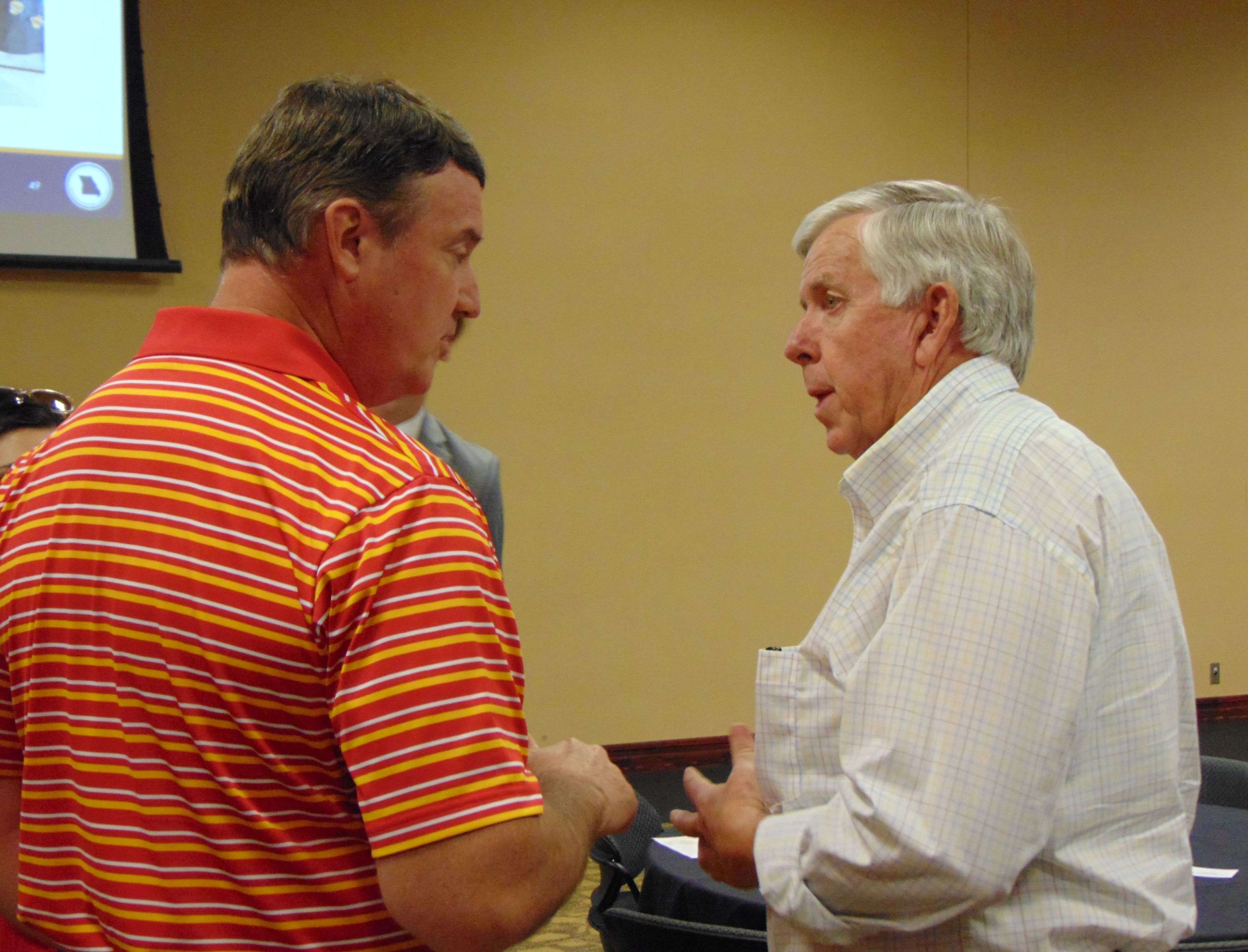 Gov. Parson talks with a constituent after speaking at MWSU/Photo by Brent Martin