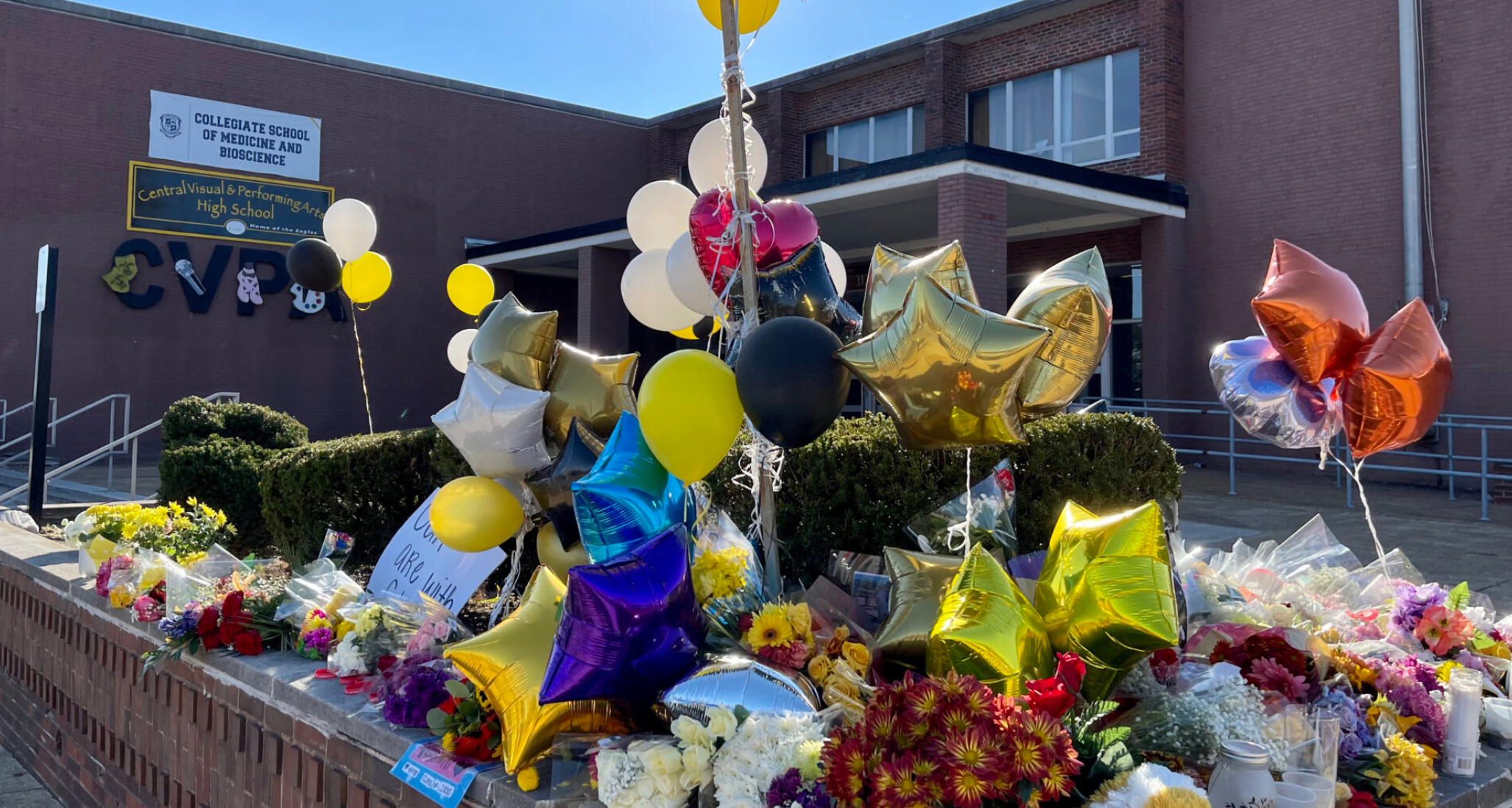  Rows of flowers and candles in front of Central Visual and Performing Arts High School in St. Louis, following the shooting on Oct. 24, 2022 that left two dead and several others wounded (Rebecca Rivas/Missouri Independent).