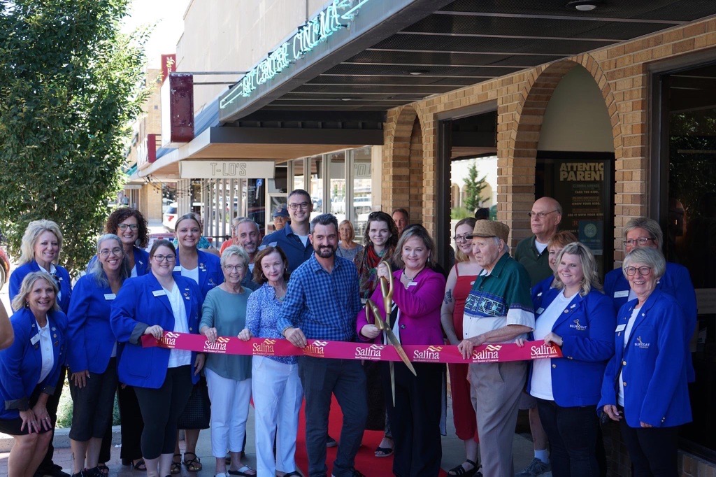 Salina Art Center Executive Director Misty Serene holds the ceremonial scissors moments before the ribbon is cut and the cinema re-opened to the public. <b>Photos by Ector Diaz/ Salina Area Chamber of Commerce</b>