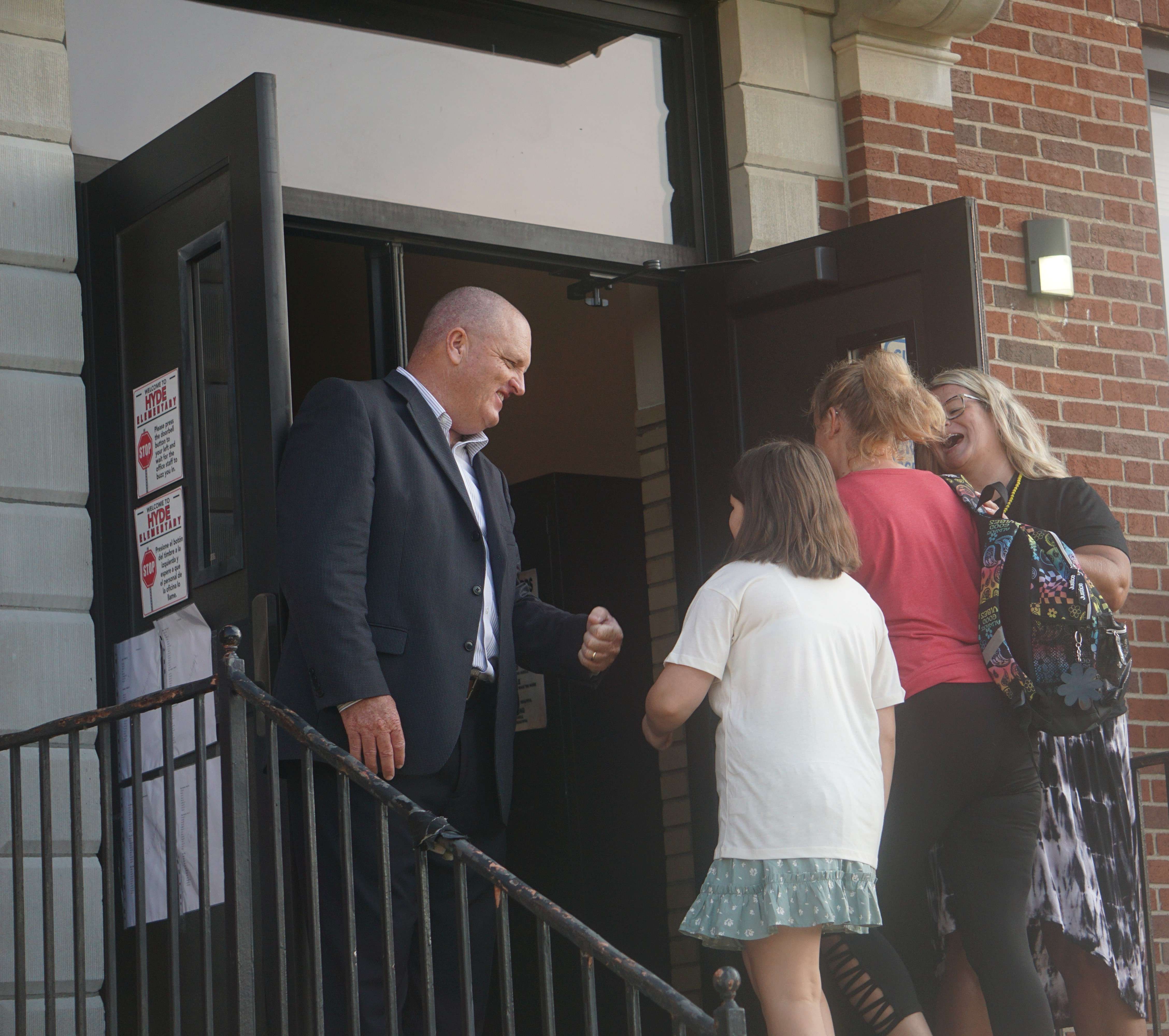 Gabe Edgar greets student at Hyde Elementary /Photo by Matt Pike