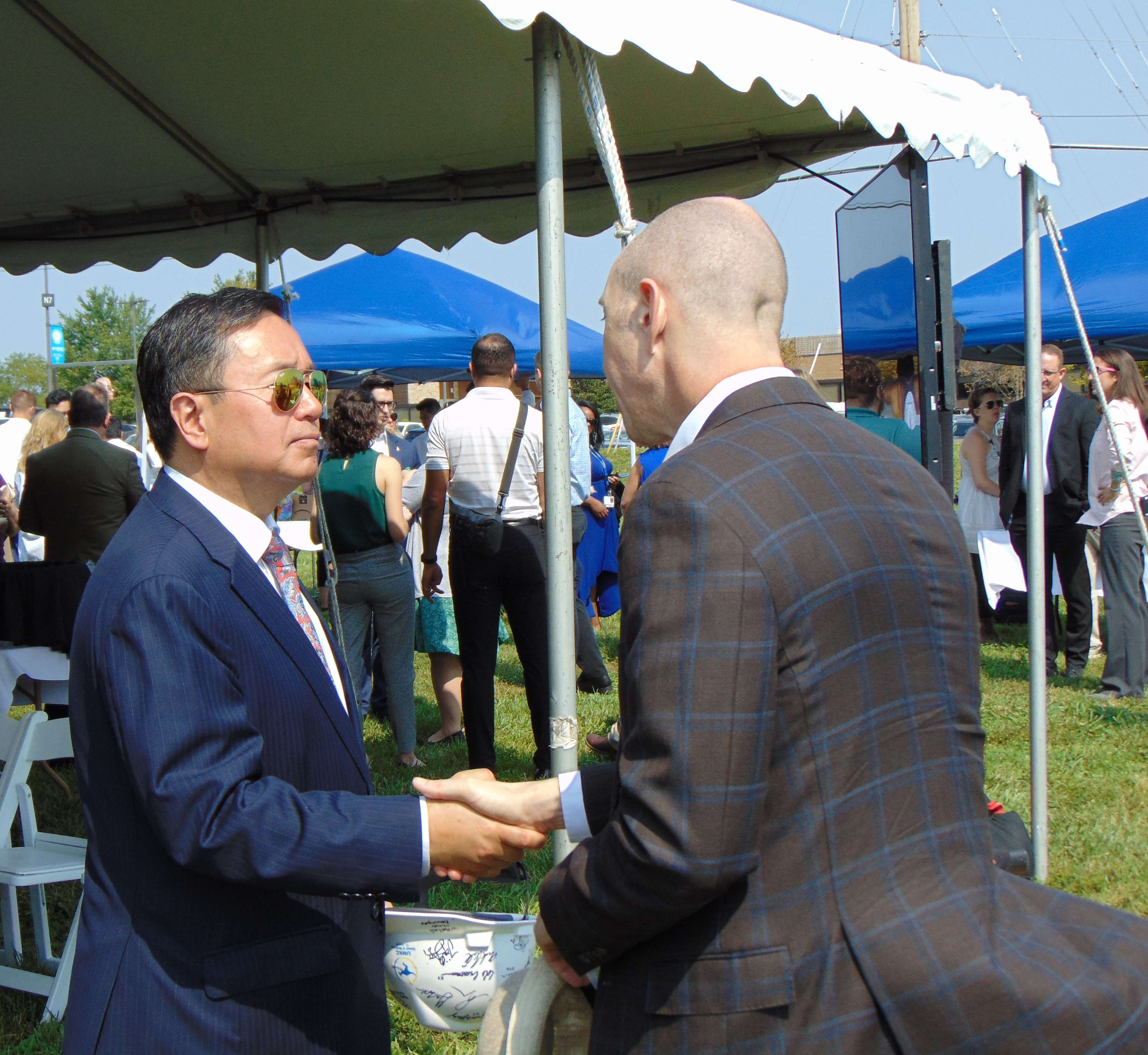 University of Missouri President Mun Choi greets an attendee at the groundbreaking ceremony for the new UMKC School of Medicine building in St. Joseph/Photo by Brent Martin