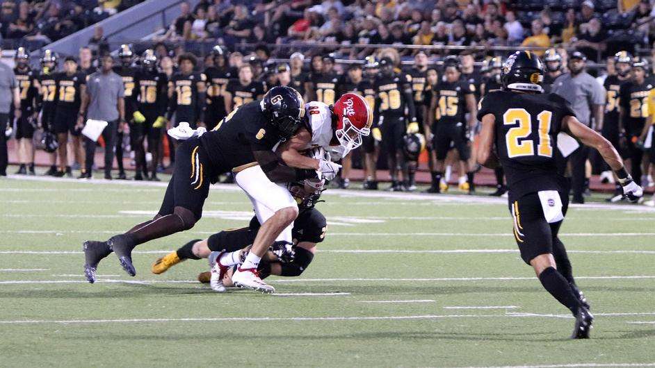 Fort Hays State linebaker Makel Williams (6) tackles Pittsburg State tight end Devon Garrison (88) in an MIAA football game Thursday, September 7, 2023 in Hays, Kan. (FHSU Athletics photo/Gillian Lynch)
