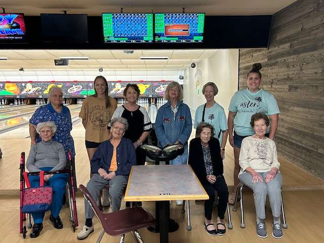 Residents and staff from Aster Estates gather during a recent outing to Walnut Bowl.