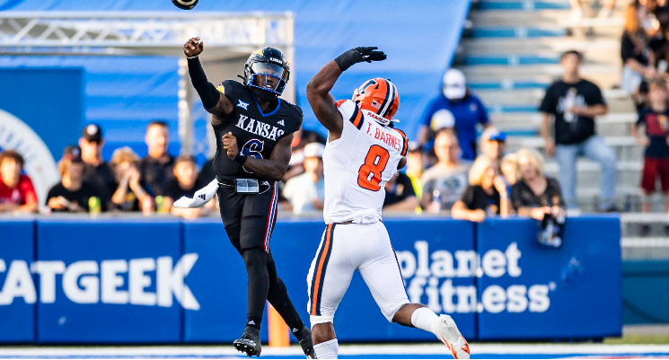 Kansas quarterback Jalen Daniels (6) attempts a pass over Illinois linebacker Tarique Barnes (8) on Friday, September 8, 2023 in Lawrence, Kan. (KU Athletics photo)