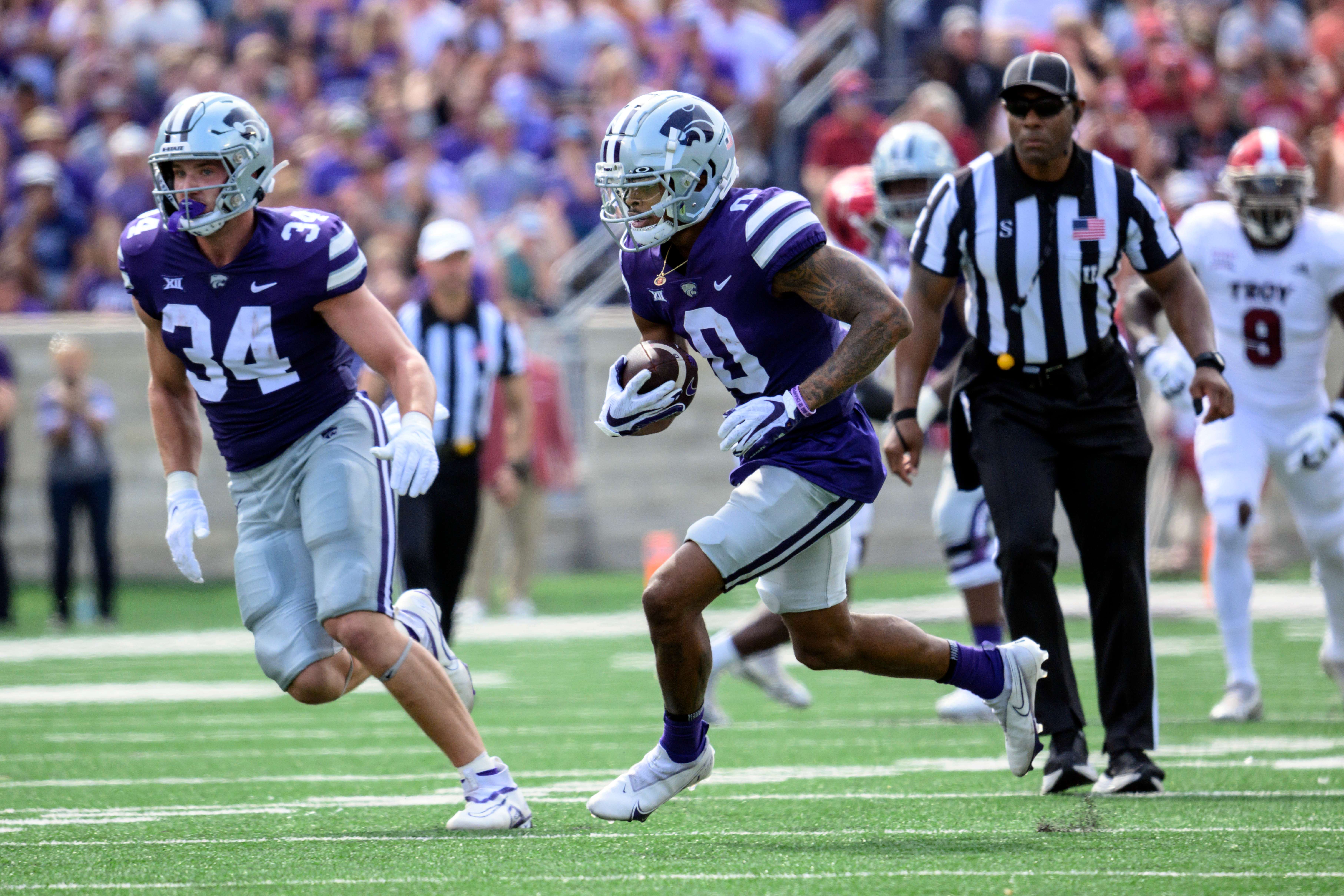 Kansas State wide receiver Jadon Jackson (0) carries the ball against Troy during the first half of an NCAA college football game in Manhattan, Kan., Saturday, Sept. 9, 2023. (AP Photo/Reed Hoffmann)