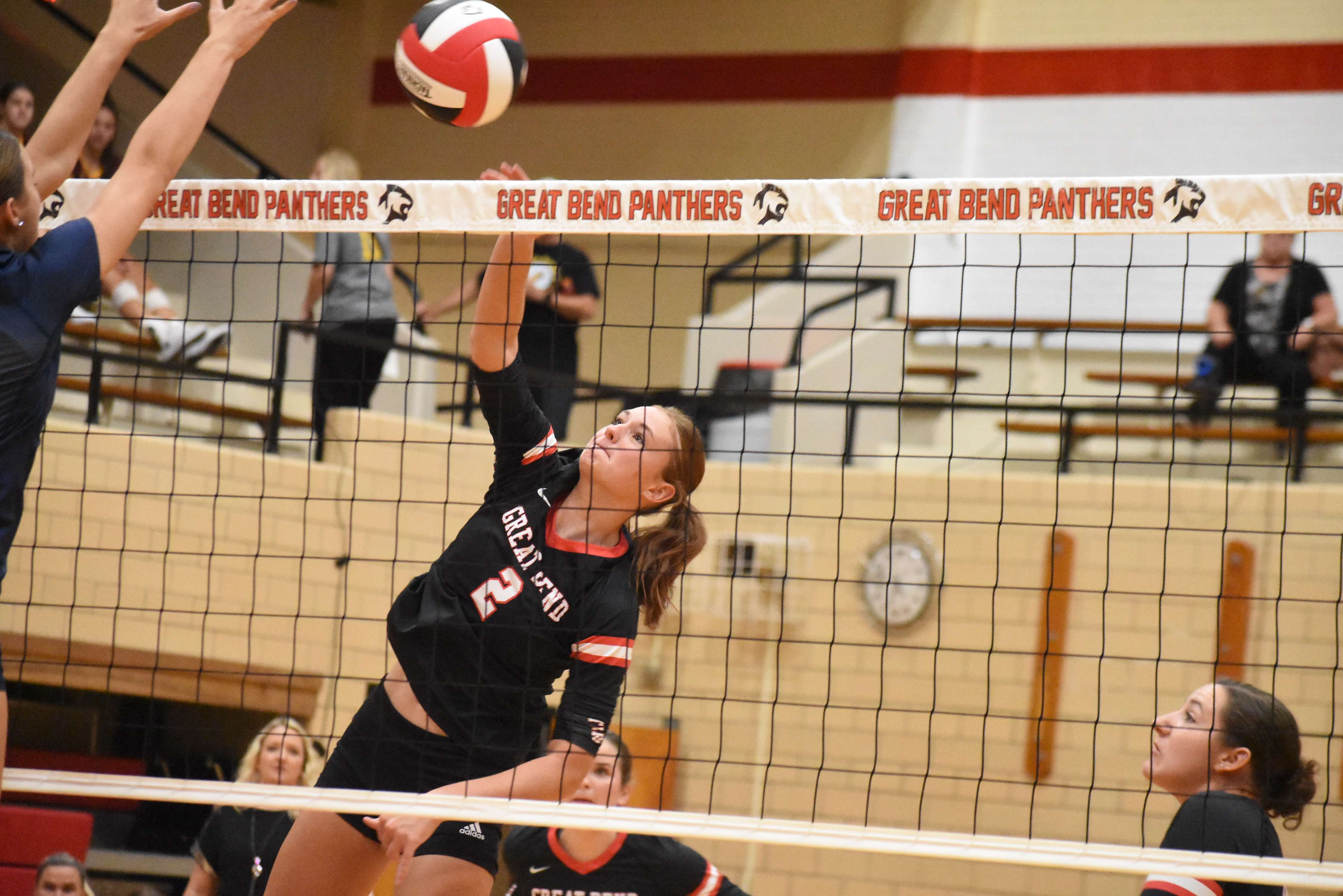 Lady Panther junior Cassie Ellegood goes up for a point in Tuesday's home match against Manhattan.