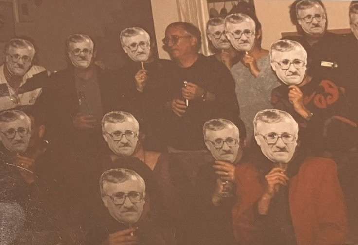 Well-wishers surround I.B. Dent (top center) with face-on-a-stick cutouts of him during his going-away party at FHSU. Courtesy photo