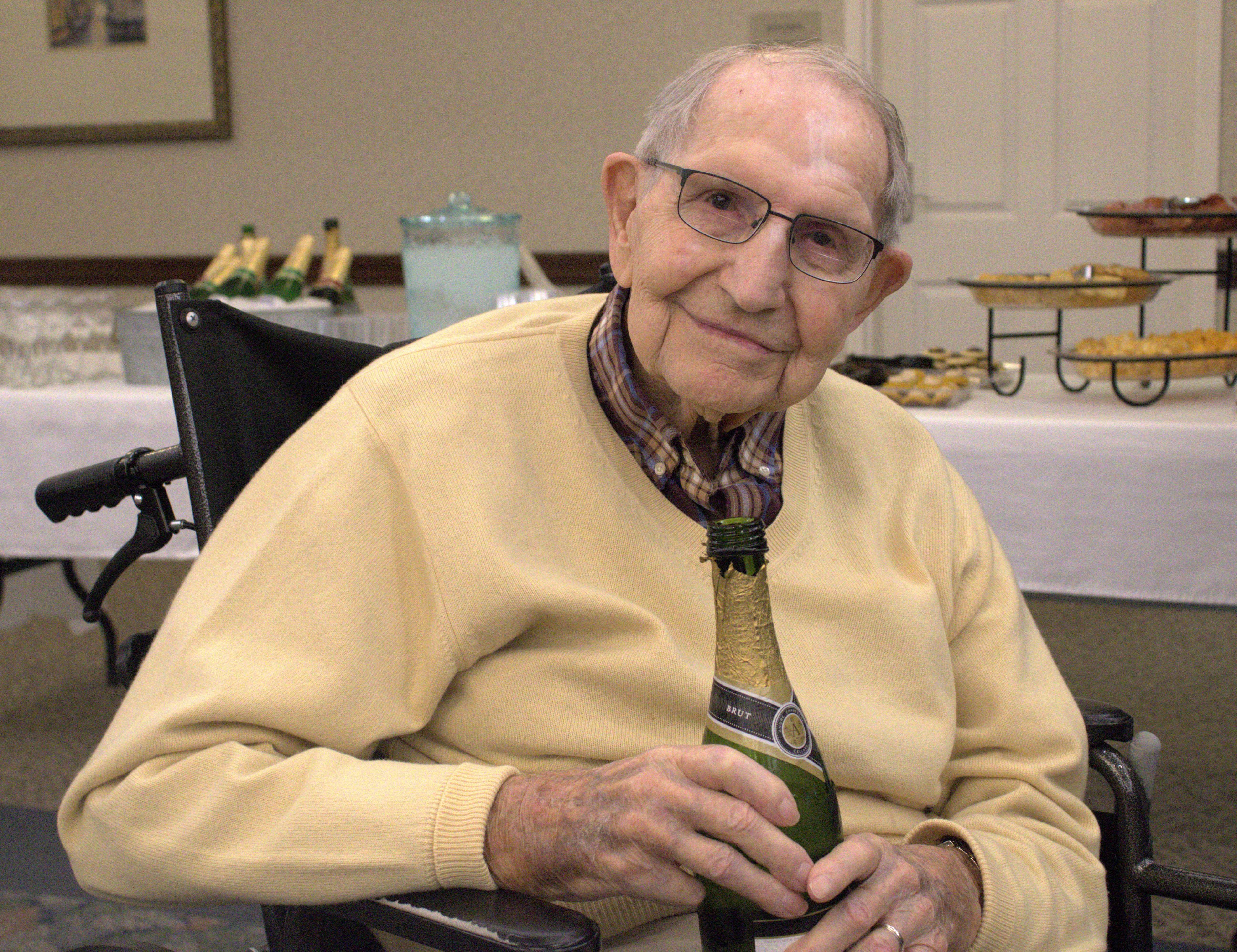 Dick Hamilton is the last surviving member of a group of Hutchinson leaders who also served in the military. He toasted his friends at an event Friday at Wesley Towers. Photo by Emmie Boese.