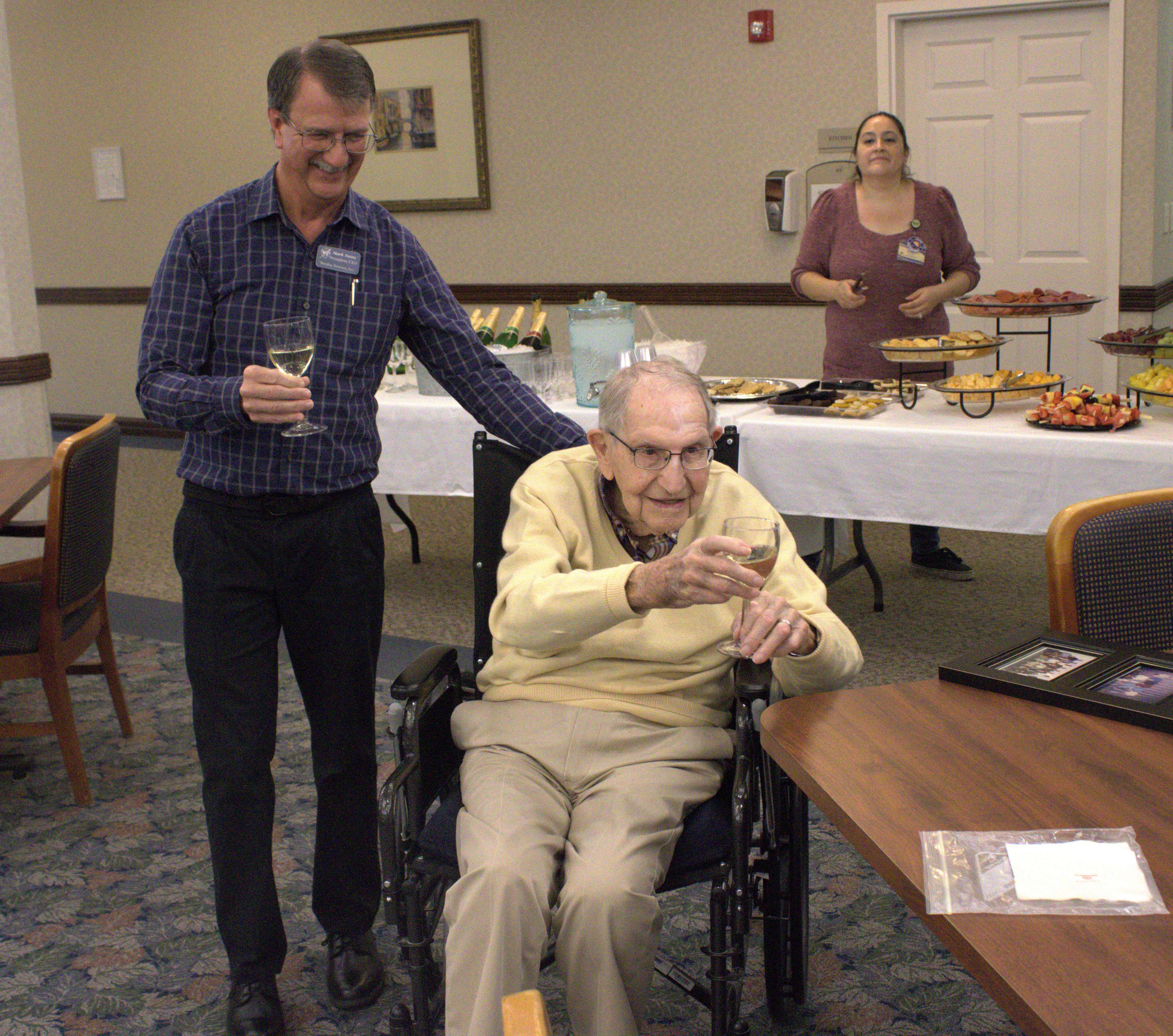 Dick Hamilton toasts the memory of his friends at an event at Wesley Towers Friday, September 15, 2023. Photo by Emmie Boese.