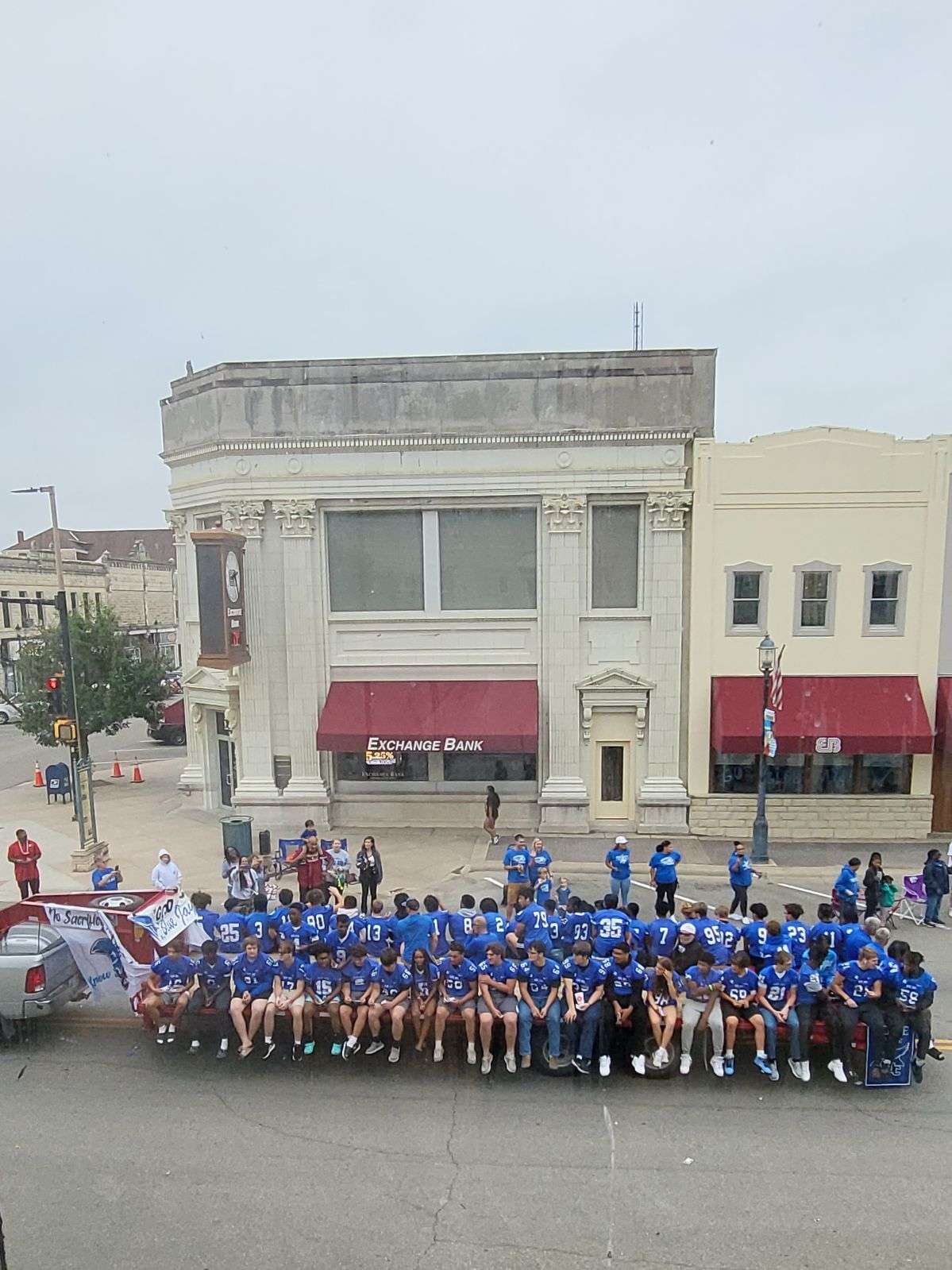 Junction City Blue Jay football team on their float in the Paint the Town Blue homecoming parade.