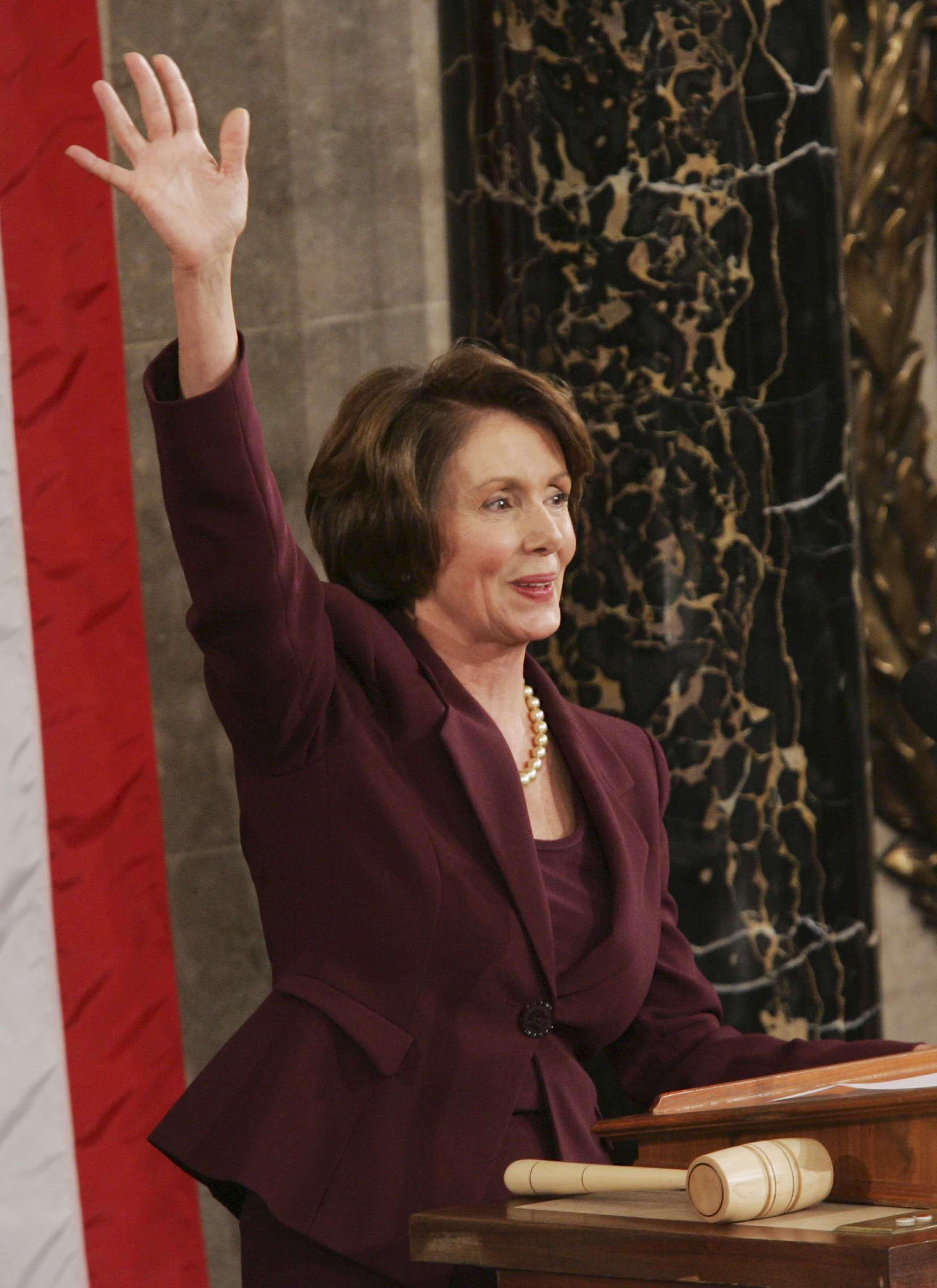 Newly elected Speaker of the House Nancy Pelosi, waves from the podium at the U.S. Capitol in Washington Thursday, Jan. 4, 2007. <b>(AP Photo/Susan Walsh)</b>