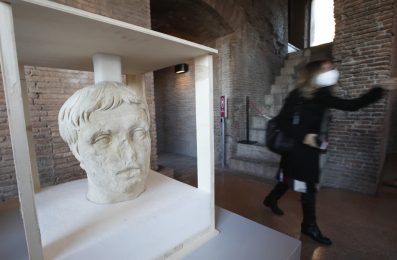 A marble head, believed to be from a statue of Roman emperor Augustus, is displayed to the press during a press conference at the Trajan Markets, which are part of the Trajan’s Forum, in Rome, Friday, Dec. 11, 2020. Archaeological excavations in one of the forums in the center of Rome brought to light a number of pieces from Imperial Rome. (AP Photo/Alessandra Tarantino)