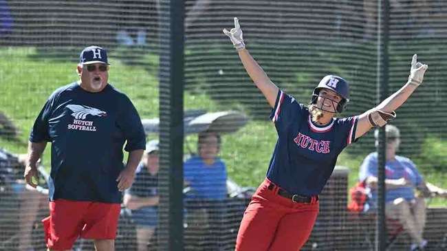 Alexis Mastin and first-base coach Ray Aguirre react after her home run in the first inning of Hutchinson's 6-4 win over Colby in the Region VI Tournament losers' bracket final on Sunday in Dodge City. (Andrew Carpenter/Blue Dragon Sports Information)