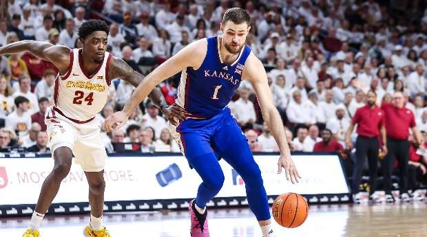 Kansas center Hunter Dickinson (1) dribbles past Iowa State's Hason Ward (24) in the second half of an NCAA college basketball game on Saturday, January 27, 2024 in Ames, Iowa. (Kansas Athletics photo)