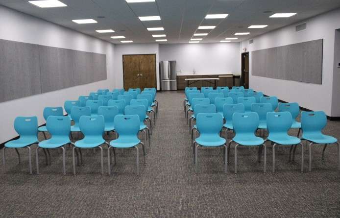 The largest new meeting room at the Hutchinson Public Library includes a kitchenette. Community members had the chance to see the room at an open house on Monday, Jan. 29. Photo by Emmie Boese.