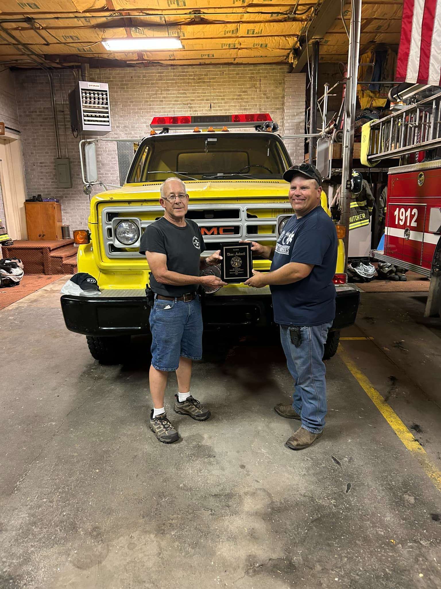 At the last Barton County Fire District #2 meeting, the district recognized fire fighter Shane Andereck for his 25 years of service to the department. Presenting him his plaque is Captain Duane Reif who also celebrated his 25 years of service earlier this year.