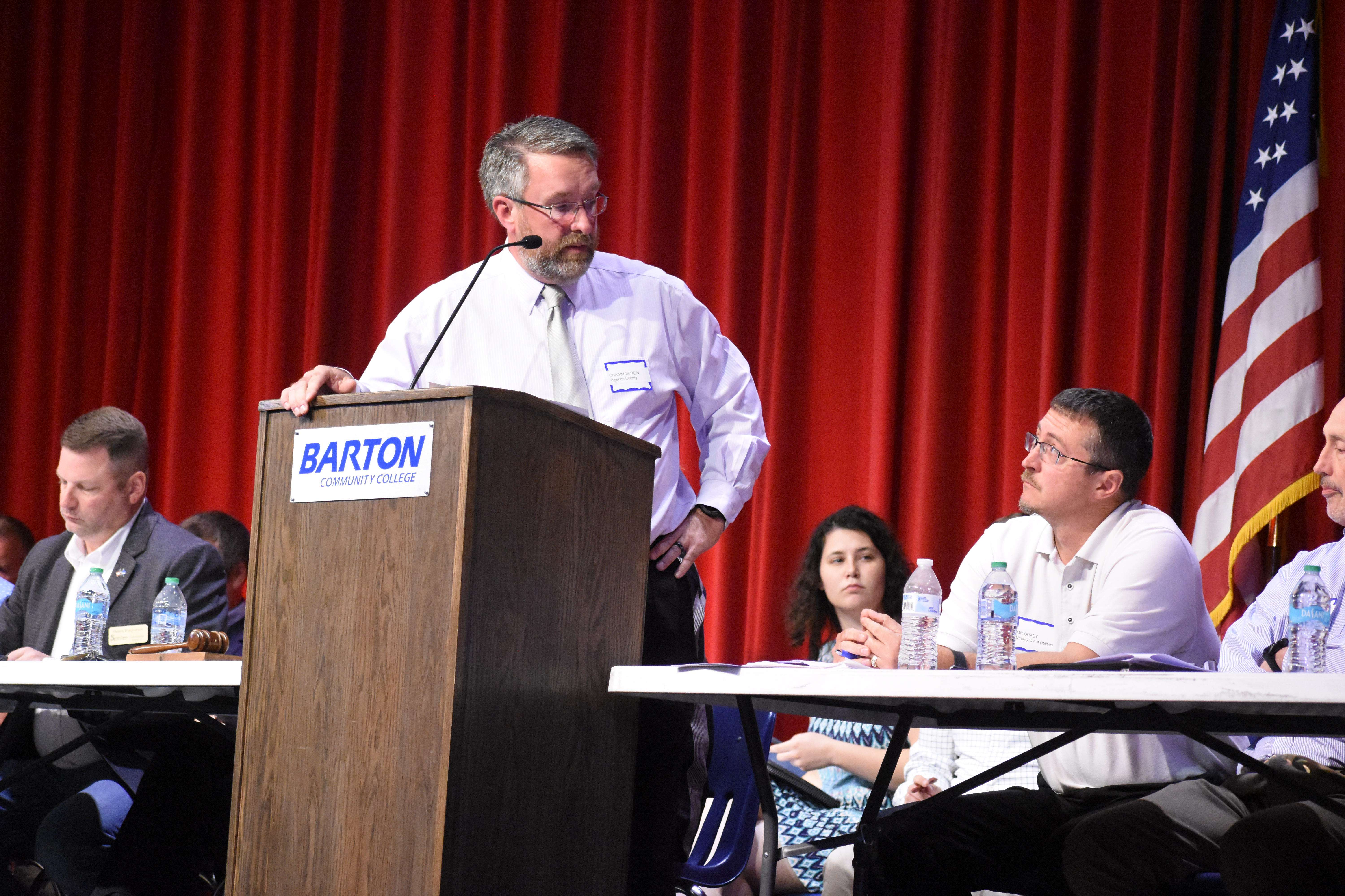 Pawnee County Commission Chair Bob Rein Jr. speaks to members of the Kansas Corporation Commission during Tuesday's tri-county meeting that featured commissioners from Barton, Pawnee, and Russell Counties. The meeting also included representatives from multiple state and federal offices.