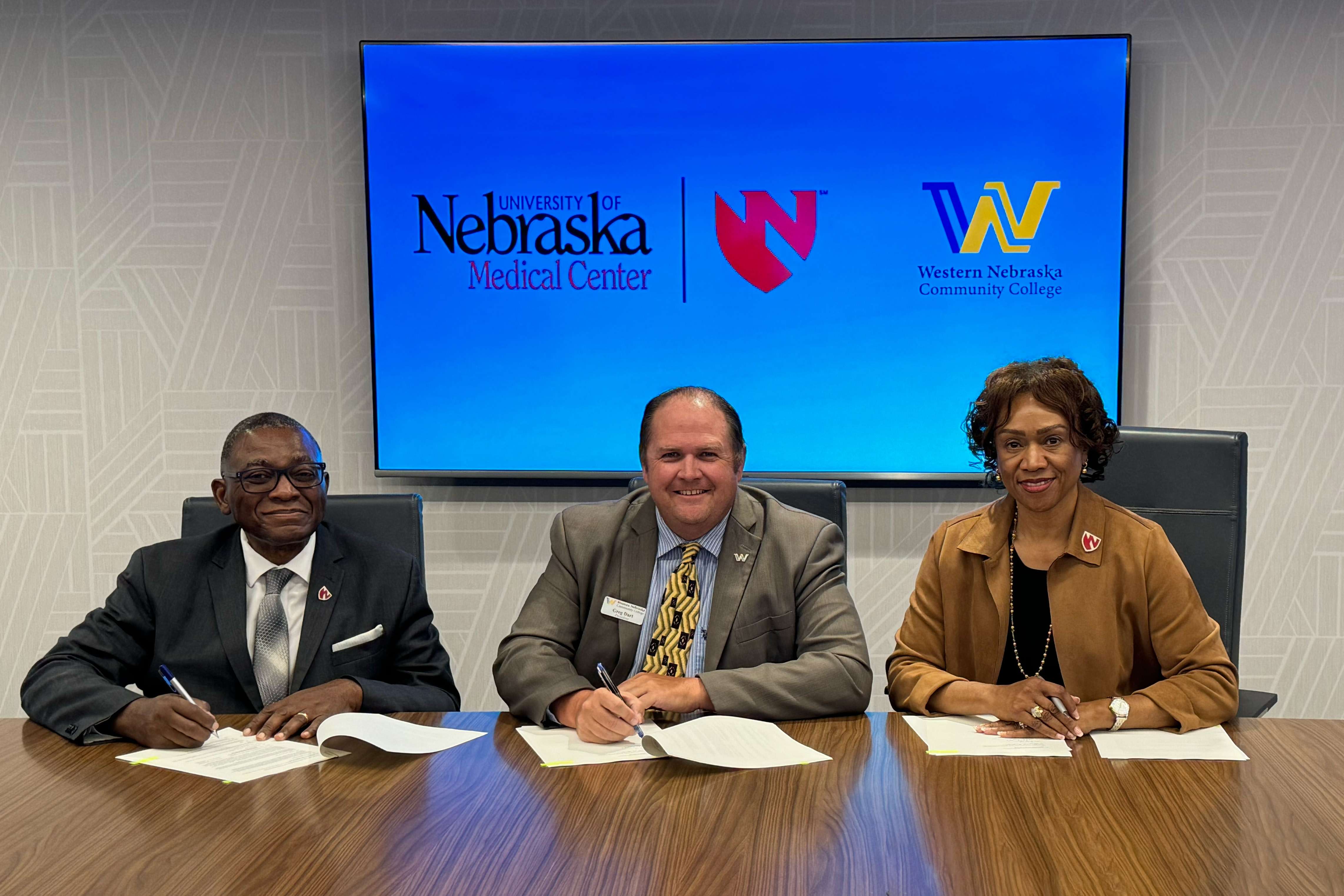 WNCCSIGNING: From left, UNMC Interim Chancellor Dele Davies, MD, President Greg Dart of Western Nebraska Community College, and UNMC College of Nursing Dean Lepaine Sharp-McHenry, DNP, at the Western Nebraska Community College signing event.