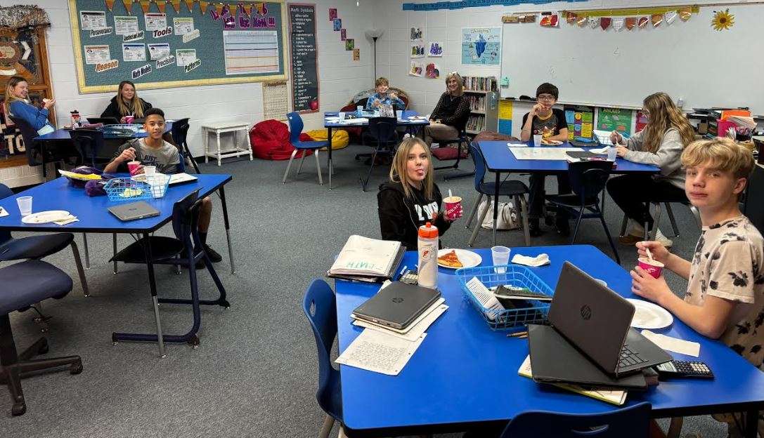 Students in Misty McCurdy's math class enjoy ice cream from Braums and Pizza from Pizza Hut as part of her being the Allen Samuels CDJR Teacher of the Month.