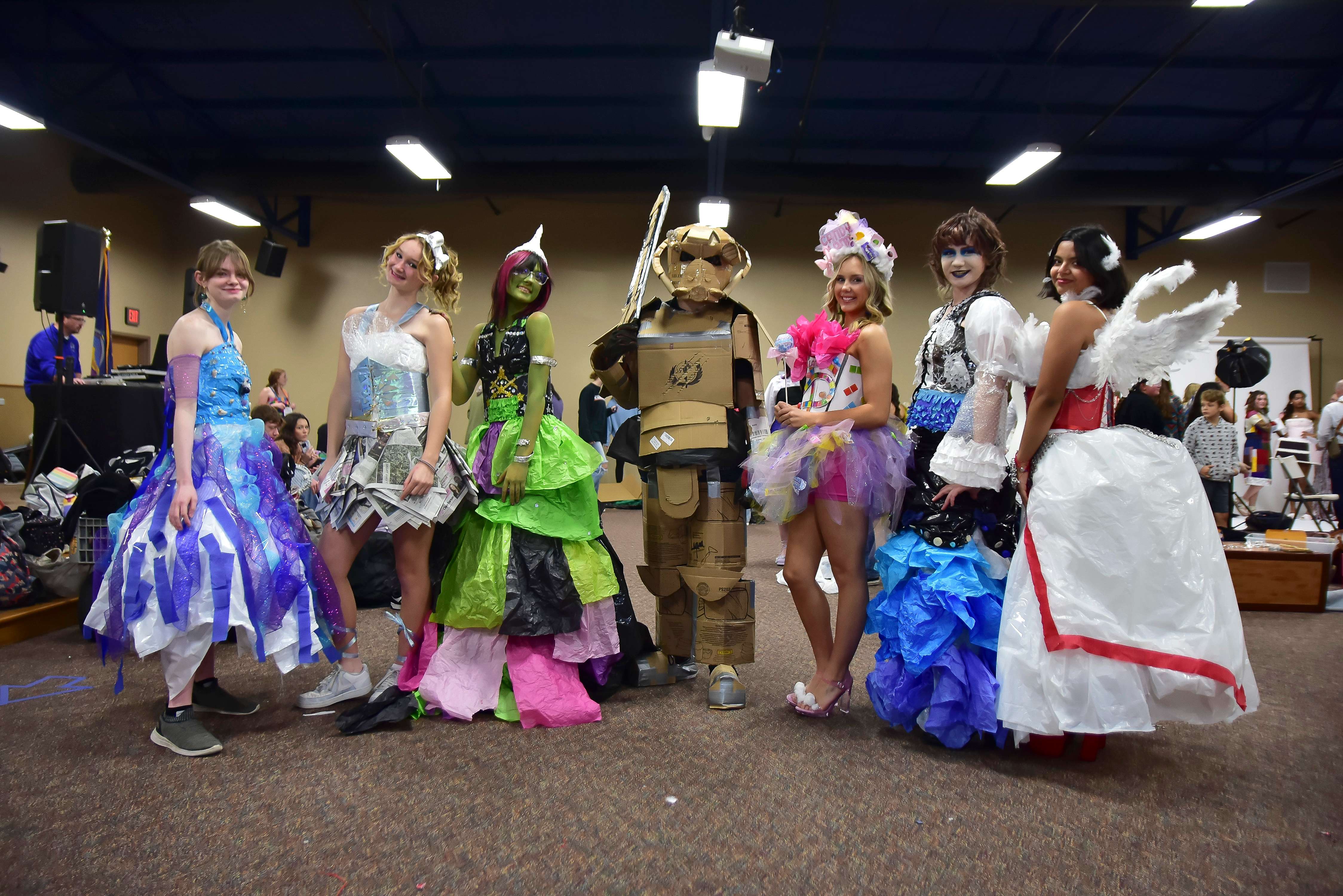 Pictured left to right: Torrie Pritchett, Mackenzie LaViolette, Ashlynn Pio, Darin Munsch, Abygail Haines-Arnold, Lea Nokes, and Diana Piedra. These students represented Great Bend High School with designs made from recycled materials