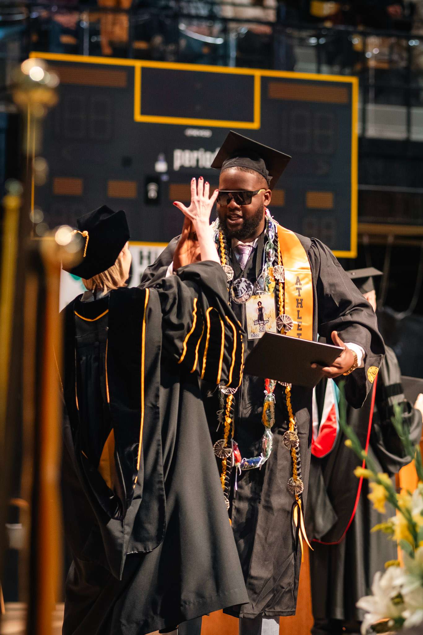 FHSU President Tisa Mason congratulates a graduate during commencement at Gross Memorial Coliseum. File photo courtesy FHSU