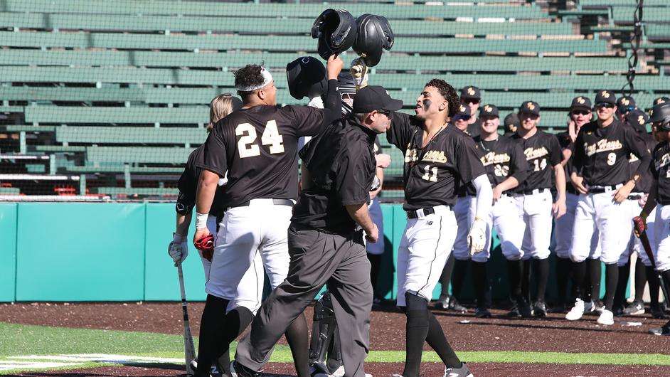 Fort Hays State's Jose Cintron (11) is congratulated after hitting a home run in an NCAA college baseball game against Adams State on Thursday, February 1, 2024 in Pueblo, Colo. (Bill Sabo, CSU-Pueblo)