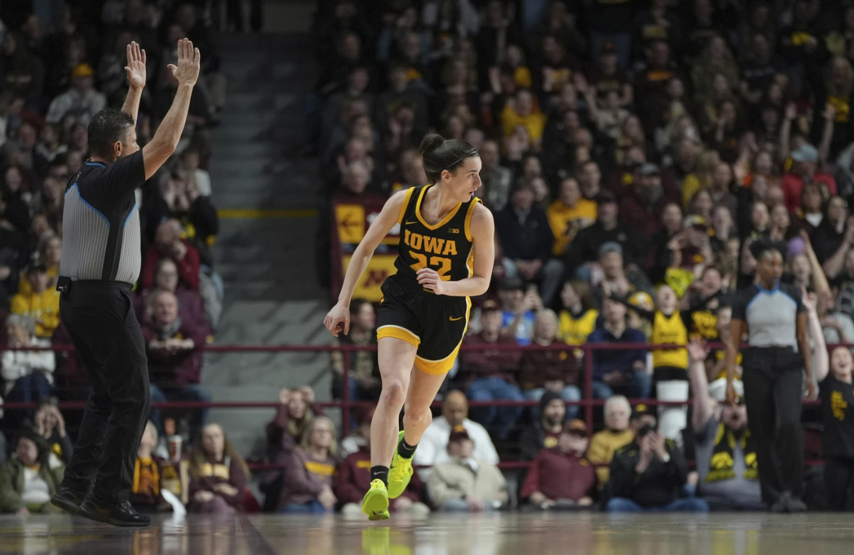 Iowa guard Caitlin Clark (22) jogs down the court after making a 3-point basket against Minnesota during the first half of an NCAA college basketball game Wednesday, Feb. 28, 2024, in Minneapolis (AP Photo/Abbie Parr)