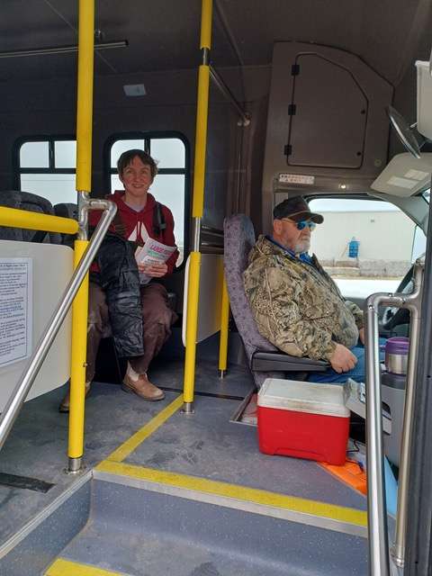 Audrey Koester, an individual served by Sunflower Diversified Services, takes advantage of the local General Public Transportation Service. The driver, George Lewis, transports Sunflower individuals and the general public to various destinations.