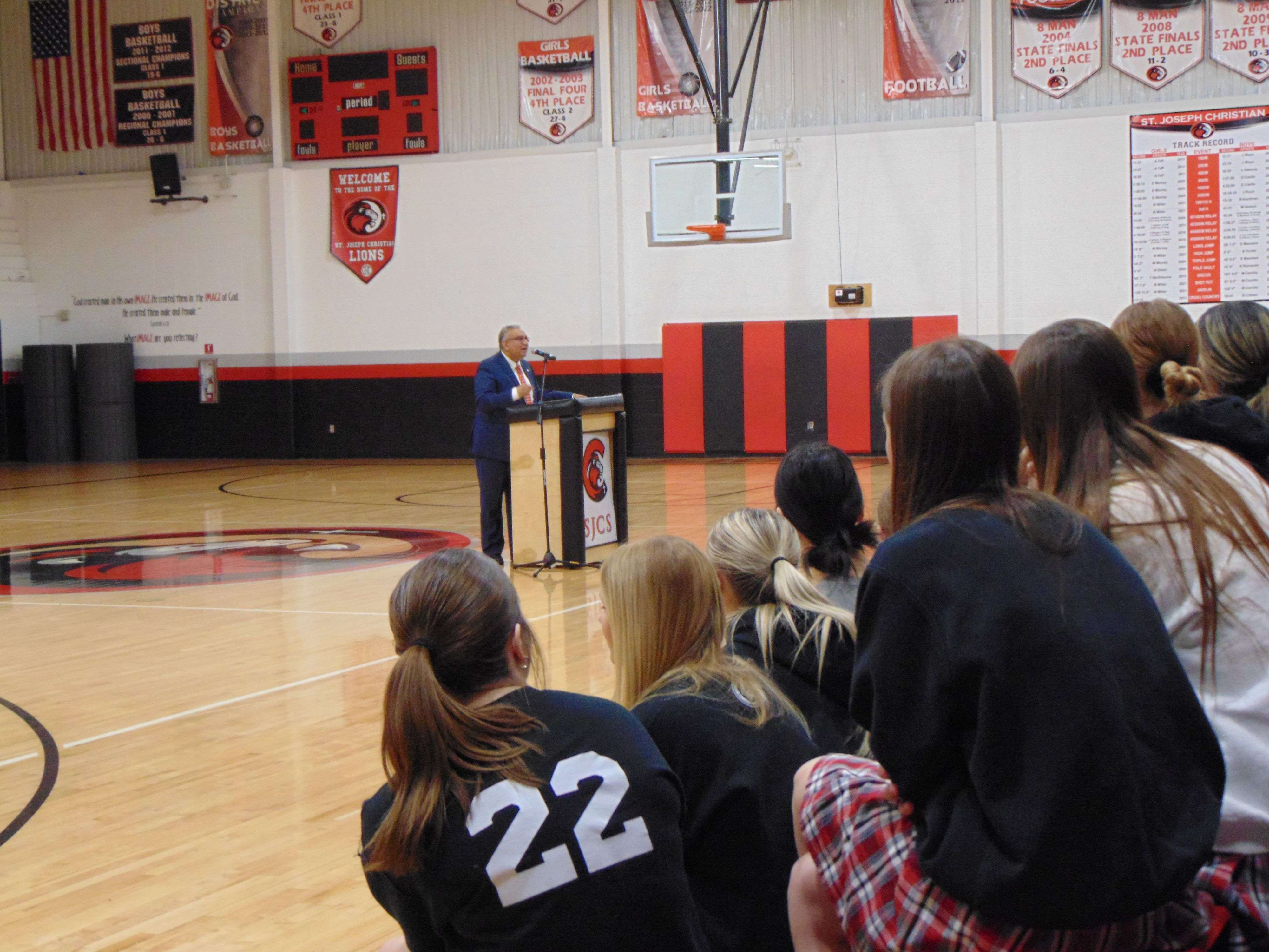 Malek speaks to an assembly at St. Joseph Christian School gym/Photo by Brent Martin