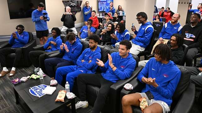 The Blue Dragon men's basketball team reacts after finding out it was selected as an at-large selection for the 2024 NJCAA Tournament at at watch party on Sunday at the Sports Arena. (Andrew Carpenter/Digital Fox Photography)
