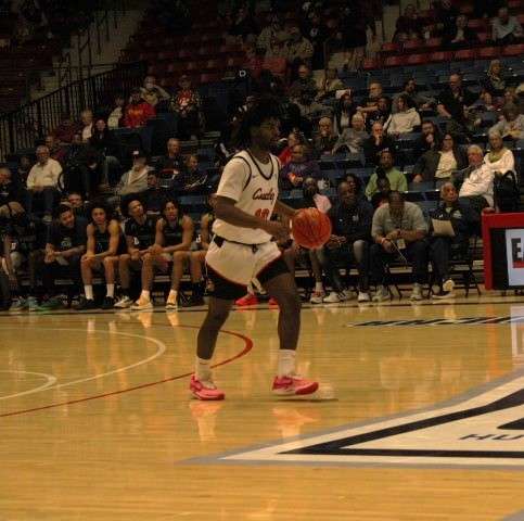 Sophomore guard Damare Smith dribbling down the court at the NJCAA Division I Men's Basketball Tournament. The Kansas City native scored 11 points for Cowley on Sunday, March 24, 2024. Photo by Emmie Boese.