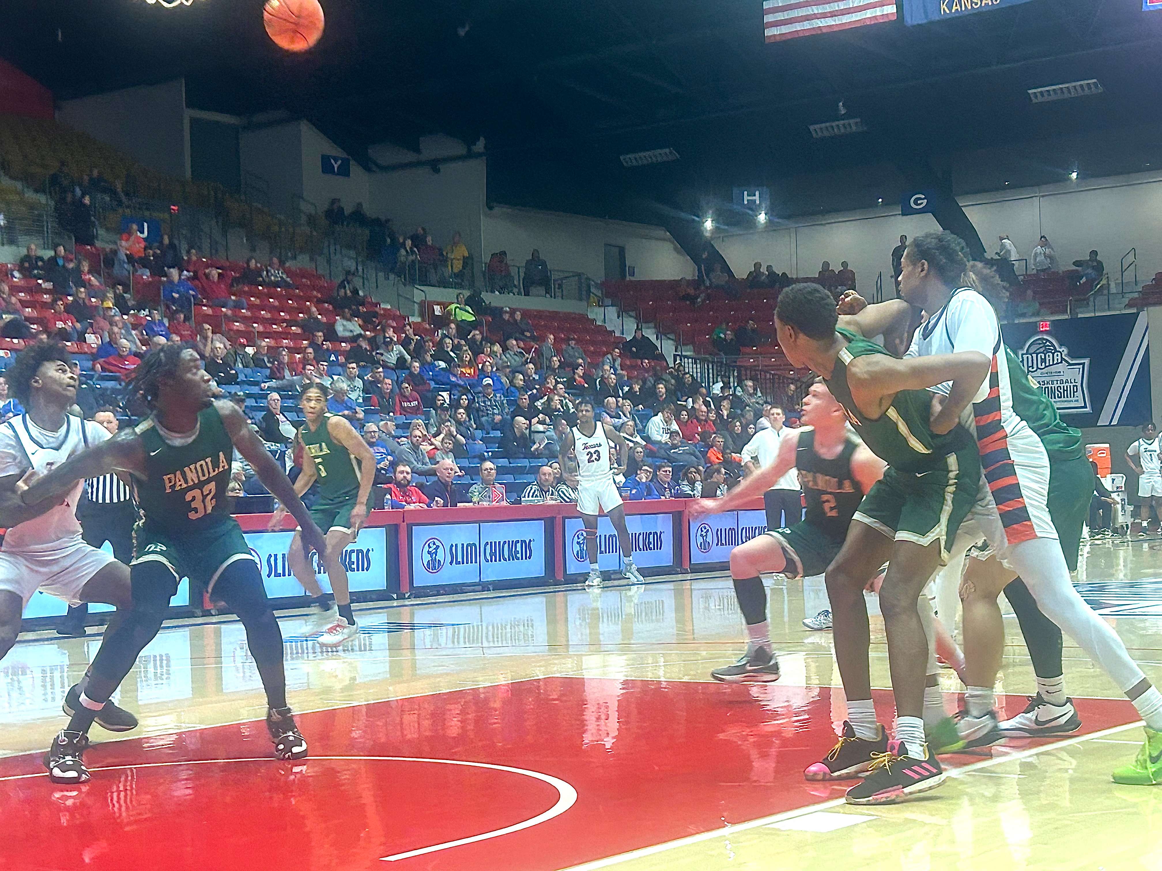 No.2 seed South Plains College players looking to snag a rebound. The Texans beat the No.15 seed Panola Ponies 80-76 in the second round of the tournament on Monday, March 25, 2024. Photo by Emmie Boese.