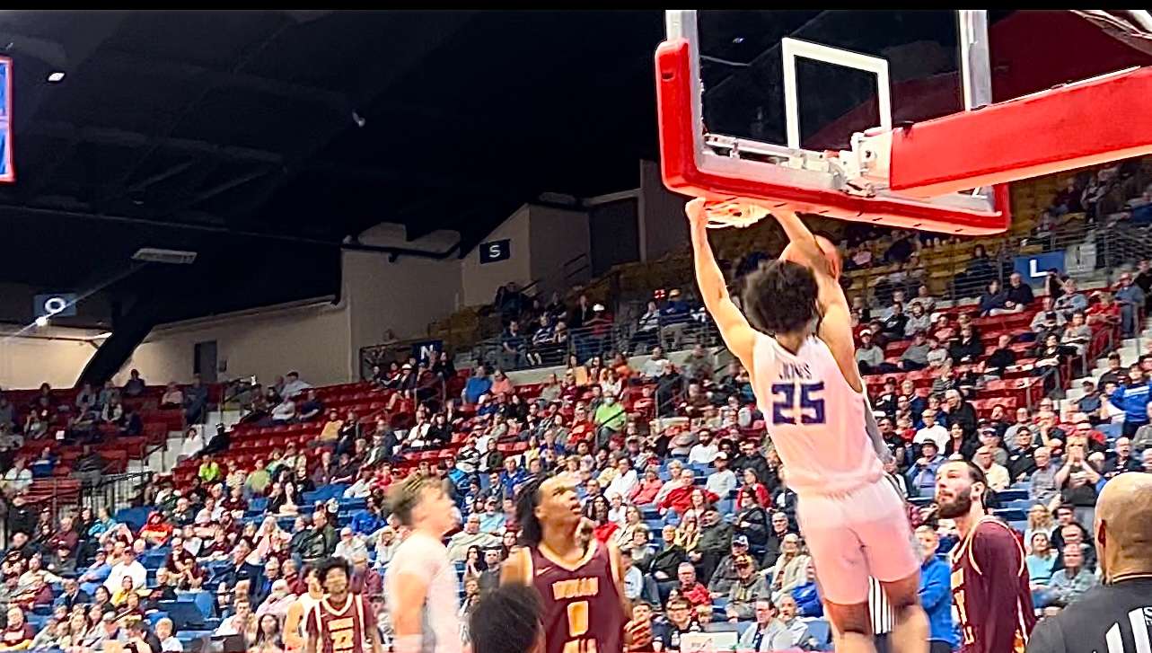 Sophomore forward Lajae Jones dunks it late in the second half against Indian Hills. Jones scored 25 points in Barton's 93-78 win over Indian Hills on Thursday, March 28. Photo by Emmie Boese.&nbsp;