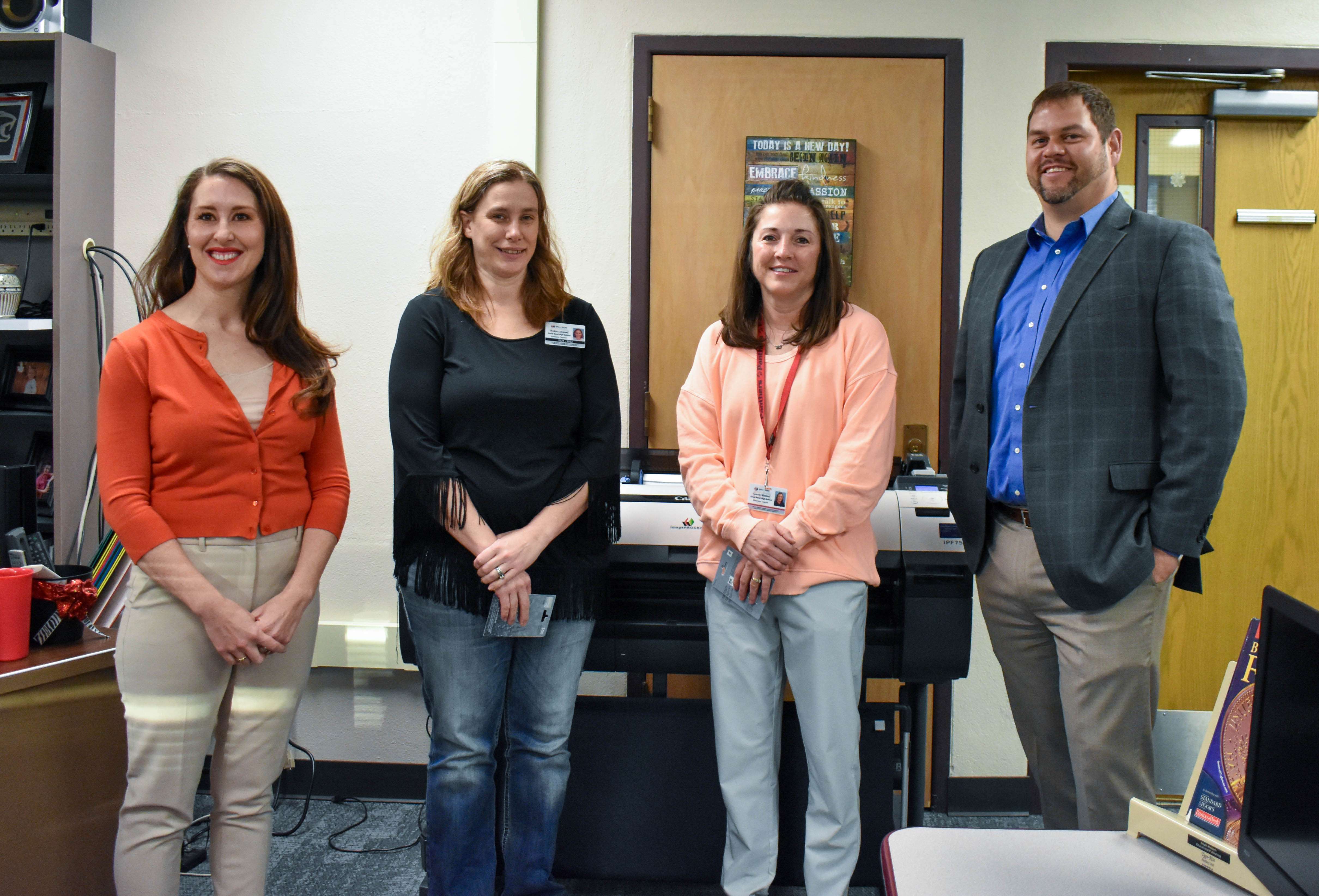Carrie Minton &amp; Robin Linsner were presented with Visa gift cards from Legacy Financial Solutions for winning first place and second place in the 2024 Investment Challenge.