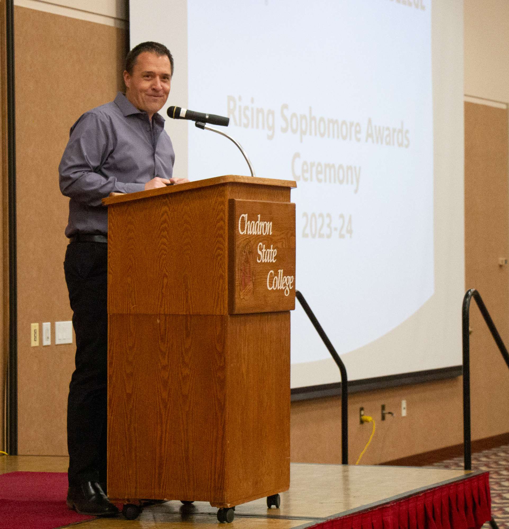 Master of Ceremonies and voice of Chadron State College athletics Dave Collins announces award winners during the ninth annual Chadron State College Rising Sophomore Award Ceremony in the Student Center April 10, 2024. (Photo by Molly Langhorst/Chadron State College)
