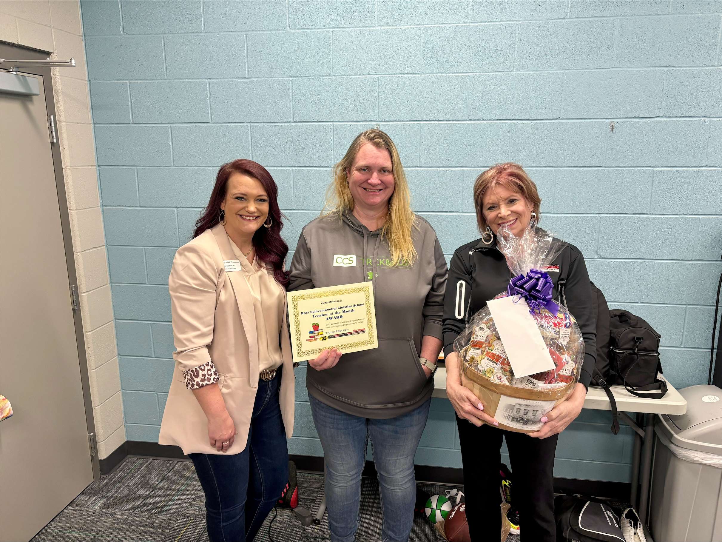 The Allen Samuels CDJR Teacher of the Month is Kara Sullivan from Central Christian School (center). Ashley Weve of EAGLE Media (left) and Chris Schul of Allen Samuels CDJR (right) presented her with gifts Friday, April 19, 2024.