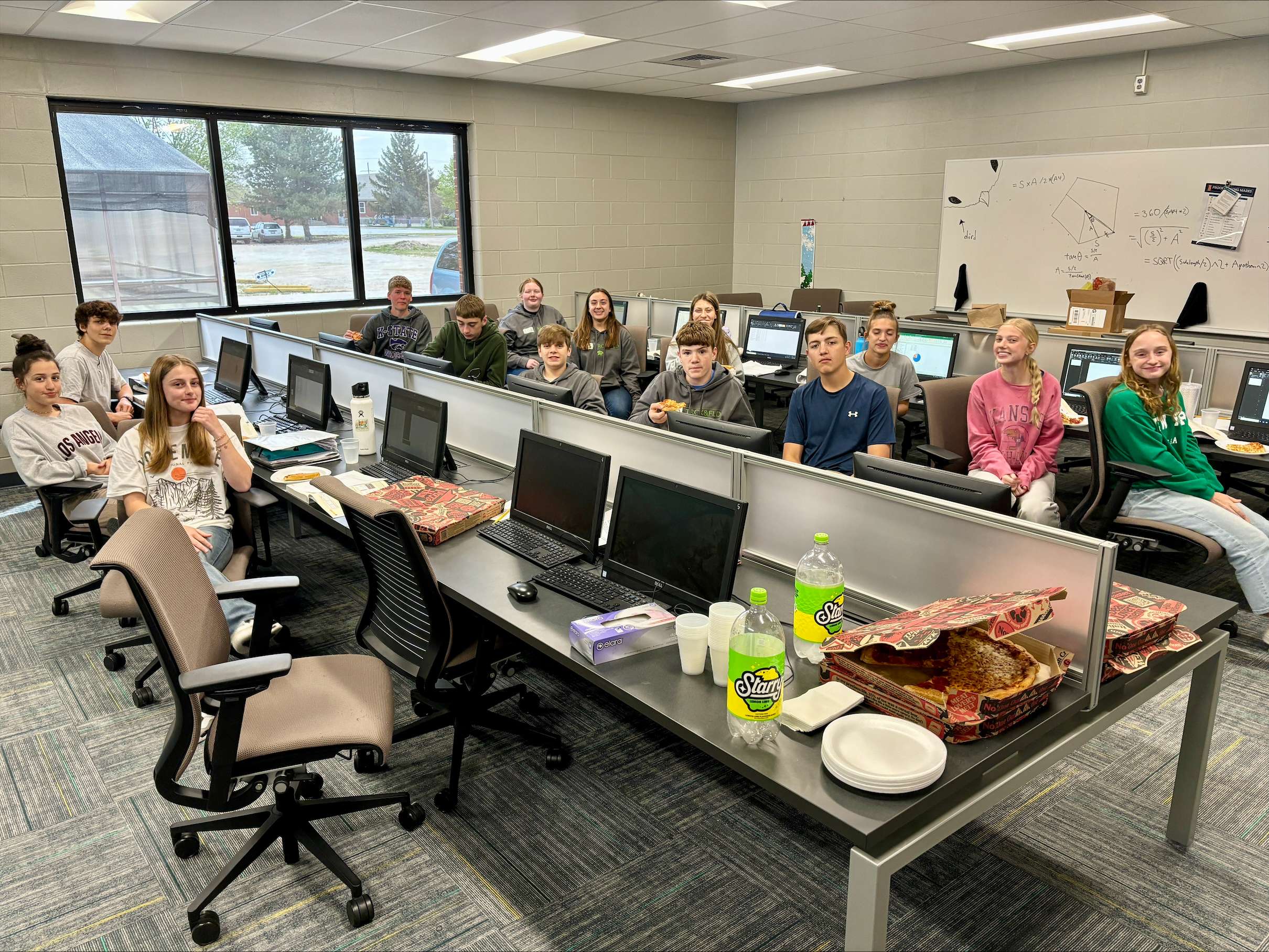 Students in Kara Sullivan's class at Central Christian School enjoy pizza from Pizza Hut.