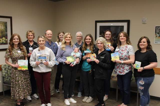 The Family Medicine Clinic staff at Pawnee Valley Community Hospital participates in a children’s literacy program called TAP-TAM, Turn a Page. – Touch a Mind.