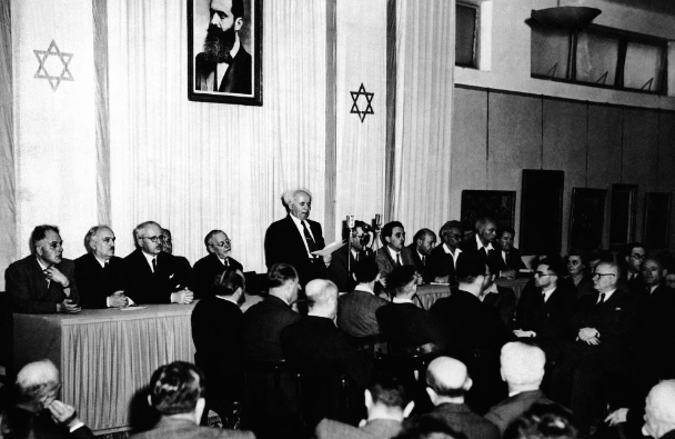 FILE - In this May 14, 1948 file photo, Cabinet Ministers of the new state of Israel are seen at a ceremony at the Tel Aviv Art Museum, marking the creation of the new state.during Premier and Defense Minister David Ben Gurion’s speech. (AP Photo, File)